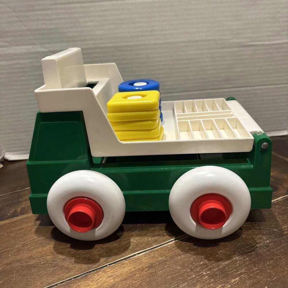 Vintage Johnson & Johnson Green Truck Toy Stack & Dump with Shapes USA 1983‎
